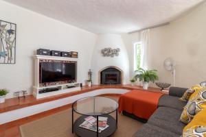 Χώρος καθιστικού στο Casa Cinquenta e Um