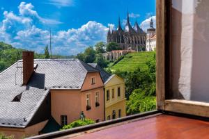 a view from a window of a castle at Starý farhof in Kutná Hora