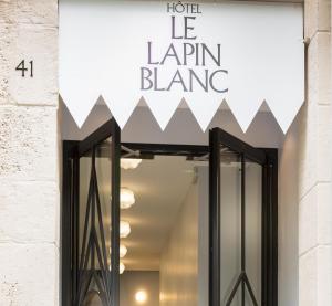 a store front with a sign that reads hotel le lenin blaze at Hotel le Lapin Blanc in Paris