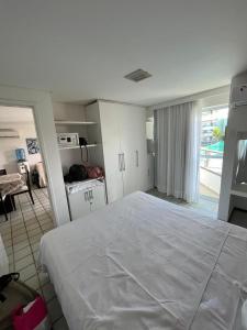 Tempat tidur dalam kamar di Porto de Galinhas Flat Ancorar