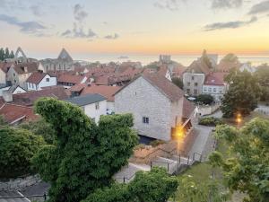 an aerial view of a town at sunset at Genuine house on northern Gotland near Slite in Lärbro