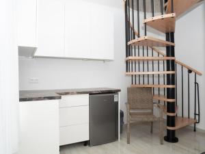 A kitchen or kitchenette at Andoravendégház - Villány