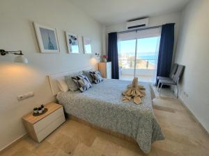 Postel nebo postele na pokoji v ubytování Apartamento Amanecer