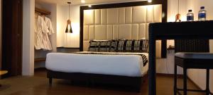 Postel nebo postele na pokoji v ubytování Hotel Bogota DC