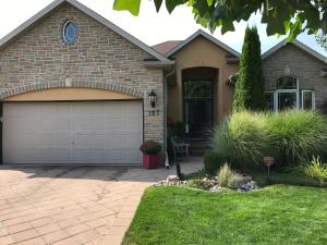 a brick house with a garage at Cozy Luxury on the Thames in Ontario! in London
