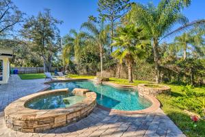 a swimming pool in a yard with a patio at Pet-Friendly Central Florida Home with Pool! in Lake Mary
