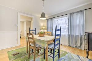 a dining room with a table and chairs and a window at Charming Hamden Home 2 Mi to Yale University in Hamden