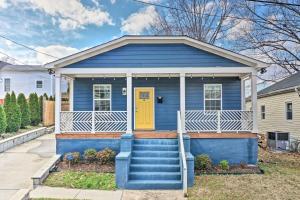 a blue house with a yellow door at Durham Vacation Rental Near Duke University in Durham