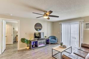 a living room with a couch and a tv at Lead Vacation Rental about 17 Mi to Sturgis in Lead