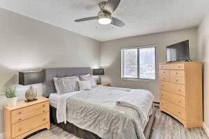 a bedroom with a bed and a dresser at Lead Vacation Rental about 17 Mi to Sturgis in Lead
