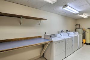 a laundry room with washing machines and a counter at Lead Vacation Rental about 17 Mi to Sturgis in Lead +20 photos