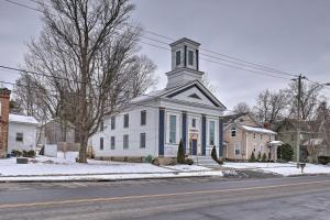 een witte kerk met een toren op een straat bij Pet-Friendly Upstate New York Vacation Rental in Rushville