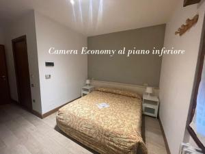 Postel nebo postele na pokoji v ubytování Hotel Sciatori 3 Stelle Superior
