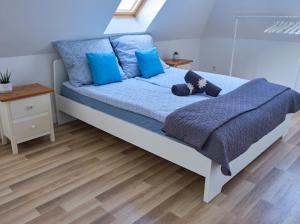 Voodi või voodid majutusasutuse Strand Apartman toas