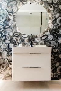 a bathroom with a white dresser and a mirror at Luxury 4 Bed Dales Retreat Private Walled Garden All Ensuite Sleeps 8 SuperKing 1 Double 2 King 1 in Embsay +44 photos