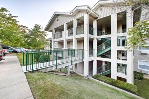 a white apartment building with a balcony at Walk-In Condo Amenities, 3 Mi to Branson Landing! in Branson