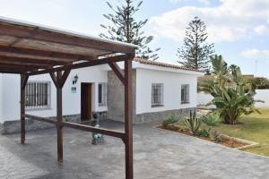 a view of the house from the courtyard at Villa María Elena, en Fuente del Gallo in Conil de la Frontera