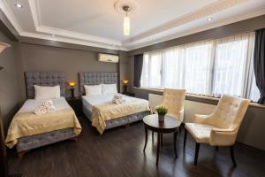 Postel nebo postele na pokoji v ubytování Cumbali Luxury Boutique Hotel