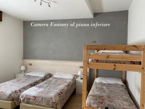 Postel nebo postele na pokoji v ubytování Hotel Sciatori 3 Stelle Superior
