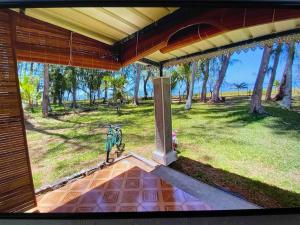 an outside view of a porch with a view of a park at Casa La Playa - # Sea,Sun & Relax # in Riambel