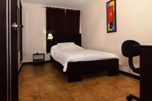 Postel nebo postele na pokoji v ubytování Hotel Alojate In