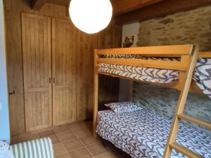 A bed or beds in a room at Cobert de Martí