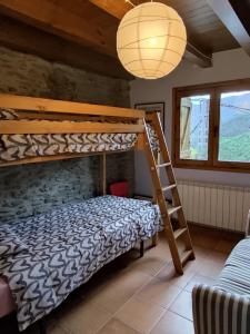 A bed or beds in a room at Cobert de Martí