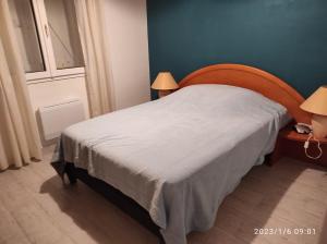 Łóżko lub łóżka w pokoju w obiekcie Er Mervent Maison de vacances