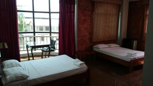 Postel nebo postele na pokoji v ubytování Hotel Paramuru + 9 fotografií