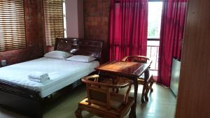 Postel nebo postele na pokoji v ubytování Hotel Paramuru