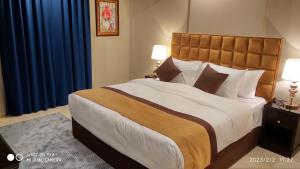 Voodi või voodid majutusasutuse يان للشقق المخدومة - Yan Apartments toas