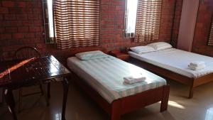 Postel nebo postele na pokoji v ubytování Hotel Paramuru