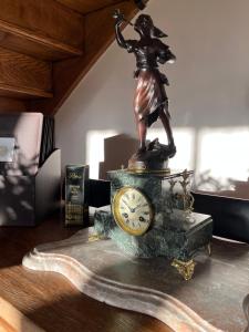 a bronze statue of a man with a racket at Le Colombier de Hanches - Teritoria in Hanches