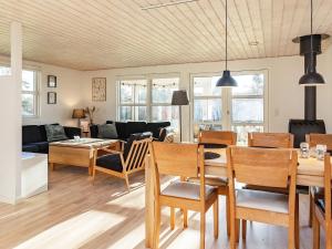 a living room and dining room with a table and chairs at 4 person holiday home in Hals-By Traum in Hals