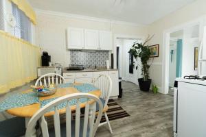 a kitchen with a table and chairs in a room at The Elizabeth Suite B2 in Hartford