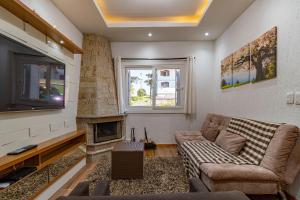 Et tv og/eller underholdning på Rosa Casa Geminada Villa Mariana