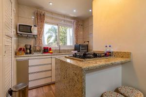 Køkken eller tekøkken på Rosa Casa Geminada Villa Mariana