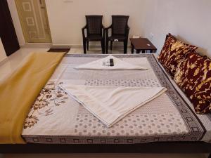 Postel nebo postele na pokoji v ubytování SKS Residency