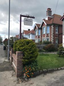 a street sign in front of a house at Amberlea Guest House in Swanage