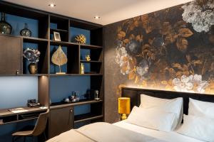 a bedroom with a bed and a wall mural at Aiola Living Graz in Graz