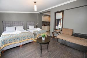 Postel nebo postele na pokoji v ubytování Cumbali Luxury Boutique Hotel