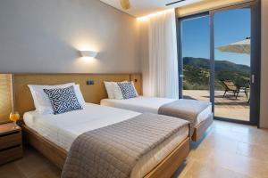 Postel nebo postele na pokoji v ubytování Villa Yasemi by Villa Plus