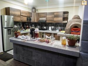 Cucina o angolo cottura di Pisonay Hotel