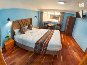 Letto o letti in una camera di Pisonay Hotel