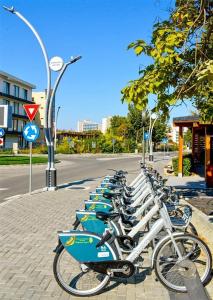 a row of bikes parked next to a street at Casa Ovi in Saturn