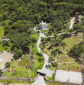 an aerial view of a park with trees and a path at Casa de Campo - Hospedar com Propósito in Florianópolis