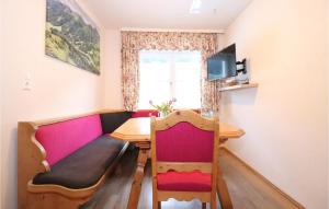a small dining room with a table and a chair at 3 Bedroom Cozy Apartment In Vodernberg in Vordernberg