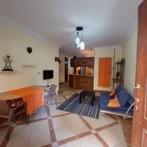 a living room with a table and a dining room at apartment with separate entrance near Arabia hotel in Hurghada