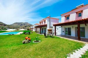 a view of the backyard of a house at Renthub Villas at Kolympia in Kolimbia