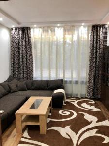 a living room with a couch and a coffee table at Messe Büro in Nuremberg